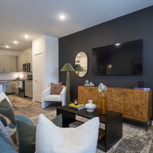 Generous living spaces to relax and unwind Furnished 1 - bedroom model at The Laurel apartments in Flowery Branch, GA.