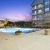 the pool and building during sunset