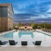 pool at dusk with seating